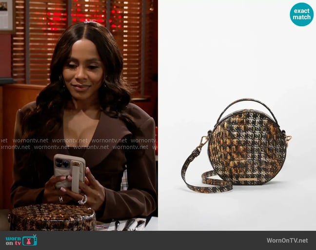 Brahmin Lane Bag in Untamed Melbourne worn by Hayley Lawson (Marquita Goings) on Beyond the Gates Brahmin Lane Bag in Untamed Melbourne worn by Hayley Lawson (Marquita Goings) on Beyond the Gates
