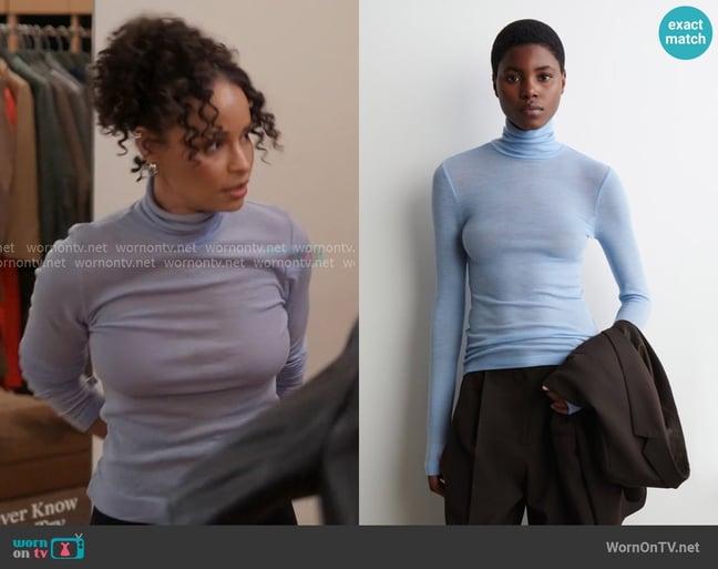Cos Merio Wool Turtleneck Top in Light Blue worn by Sai De Silva on The Real Housewives of New York City Cos Merio Wool Turtleneck Top in Light Blue worn by Sai De Silva on The Real Housewives of New York City
