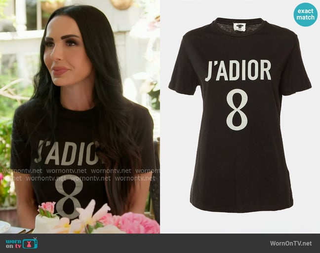 Dior J'adior Graphic Tee with Silver Print worn by Carmella Garcia on The Real Housewives of Orange County Dior J'adior Graphic Tee with Silver Print worn by Carmella Garcia on The Real Housewives of Orange County