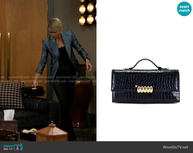 Retrofete Phoebe Clutch worn by Vanessa McBride (Lauren Buglioli) on Beyond the Gates