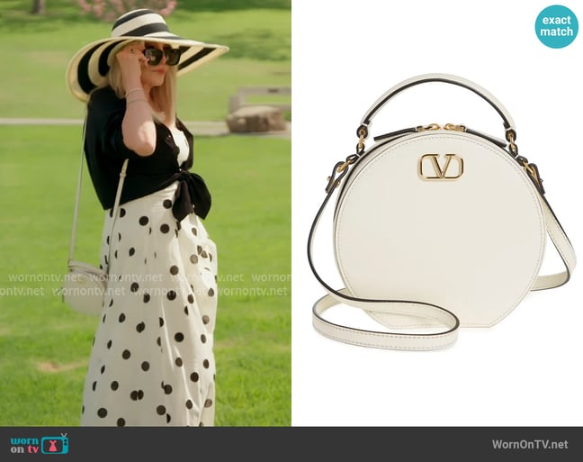 Valentino VLOGO Signature Circle Crossbody Bag worn by Shannon Beador on The Real Housewives of Orange County Valentino VLOGO Signature Circle Crossbody Bag worn by Shannon Beador on The Real Housewives of Orange County