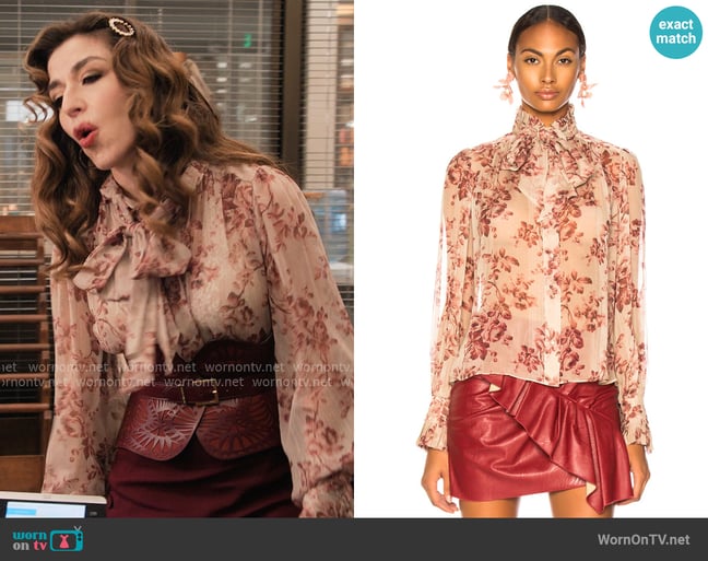 Zimmermann Unbridled Tie Neck Blouse in Sand Wild Floral worn by Esmeralda Grand (Sabrina Impacciatore) on The Paper Zimmermann Unbridled Tie Neck Blouse in Sand Wild Floral worn by Esmeralda Grand (Sabrina Impacciatore) on The Paper