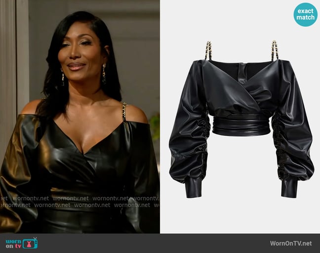 Micas Faux Leather Metallic Crossed Long-Sleeve Shirt worn by Dana 'Leslie' Thomas (Trisha Mann-Grant) on Beyond the Gates Micas Faux Leather Metallic Crossed Long-Sleeve Shirt worn by Dana 'Leslie' Thomas (Trisha Mann-Grant) on Beyond the Gates
