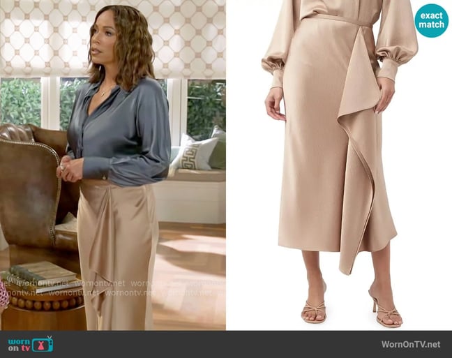 Trina Turk Sahel Satin Asymmetric Midi-Skirt in Camel worn by Nicole Dupree Richardson (Daphnee Duplaix) on Beyond the Gates Trina Turk Sahel Satin Asymmetric Midi-Skirt in Camel worn by Nicole Dupree Richardson (Daphnee Duplaix) on Beyond the Gates
