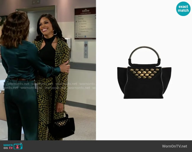 Zara Split Suede Mini City Bag with Studs worn by Dani Dupree (Karla Mosley) on Beyond the Gates Zara Split Suede Mini City Bag with Studs worn by Dani Dupree (Karla Mosley) on Beyond the Gates