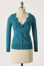 Teal cardigan with crochet flowers at Anthropologie