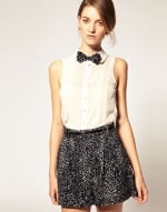 Cream sleeveless top with bow tie at Asos