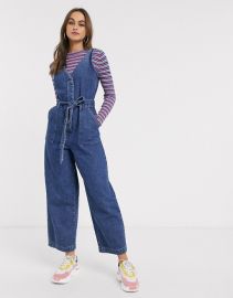 ASOS DESIGN denim v neck jumpsuit in blue at Asos