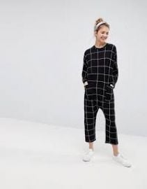 ASOS DESIGN minimal jersey jumpsuit with batwing sleeve in check print at ASOS