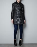 Alex's long black quilted coat at Zara