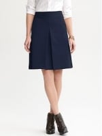 Ann's navy pleat skirt at Banana Republic at Banana Republic