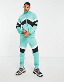 Another Influence retro matchday tracksuit set in turquoise at ASOS