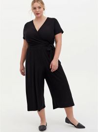 BLACK TEXTURED KNIT SURPLICE CULOTTE JUMPSUIT at Torrid