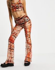 Bershka exposed seam patterened flare pants with thong detail in orange at ASOS