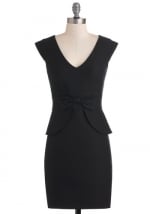 Black peplum dress with bow front at Modcloth