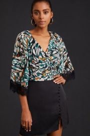 By Flutter-Sleeve Wrap Top at Anthropologie