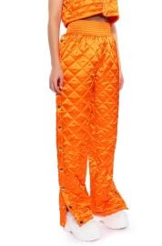 COZY MODE QUILTED SATIN BREAKAWAY JOGGER IN ORANGE at Akira