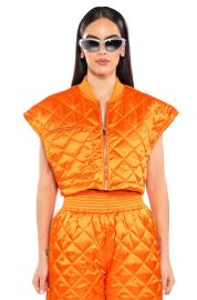 COZY MODE QUILTED SATIN VEST IN ORANGE at Akira