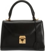 Carries black bag at Barneys at Barneys