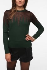 Carrie's green glitter sweater at Urban Outfitters