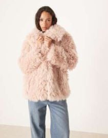 DESIGN faux fur sheepskin coat in dusty pink at ASOS