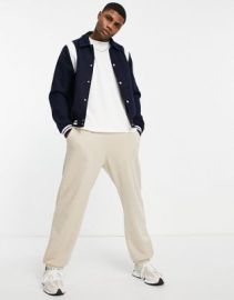 DESIGN varsity bomber jacket in navy with contrast white inserts at ASOS