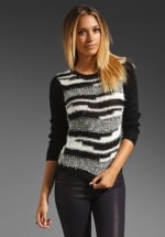 Dorrit's black and white Alice and Olivia sweater at Revolve