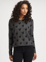 Dorrit's grey sweater at Saks Fifth Avenue