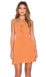 FLYNN SKYE Leila Lace Up Mini Dress in Pumpkin Seeds at Revolve