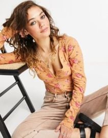 Free People Dylan floral printed henley bodysuit in peach at ASOS