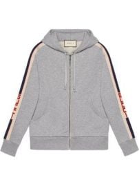 Gucci Hooded zip-up sweatshirt with Gucci stripe Hooded zip-up sweatshirt with Gucci stripe at Farfetch