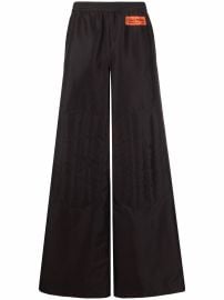 Heron Preston logo-patch wide-leg Trousers - at Farfetch