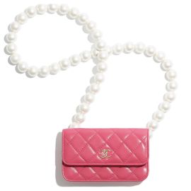 Lambskin clutch with pearls and chain by Chanel at CHANEL