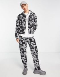 Liquor N Poker straight leg denim jeans in black with all over dragon print - part of a set at ASOS