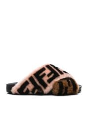 Logo Print Shearling Cross Strap Slides by Fendi at Forward