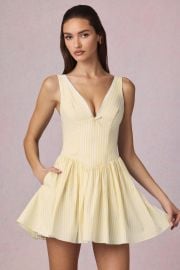 Marissa Bow-Detail A-Line Mini Dress in Lemon Yellow Stripe at Oh Polly