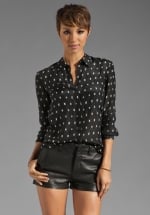 Mindy's black shirt at Revolve