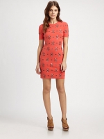 Mindy's coral dress at Saks Fifth Avenue