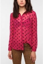 Mindy's pink polka dot shirt at Urban Outfitters