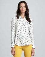 Mindy's white patterned shirt on The Mindy Project at Neiman Marcus