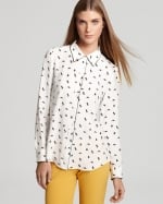 Mindy's white printed shirt at Bloomingdales at Bloomingdales