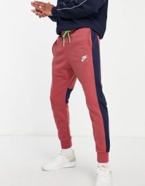 Nike Air cuffed fleece sweatpants in dusty brownnavy at ASOS