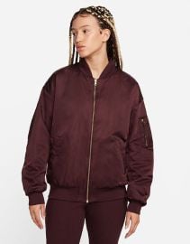 Nike Road To Wellness bomber jacket in burgundy at ASOS