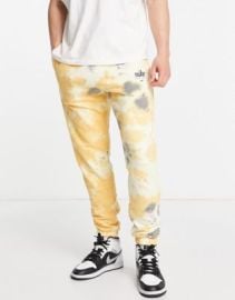 Nike Seasonal Classics acid wash casual fit cuffed fleece sweatpants at ASOS