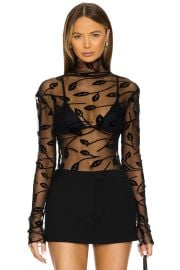 Norma Kamali Long Sleeve Turtleneck Top In Black Leaf at Revolve