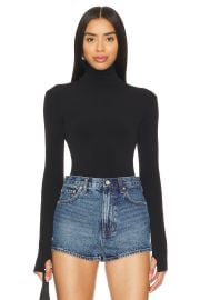 Norma Kamali Slim Fit Long Sleeve Turtleneck Top In Black at Revolve