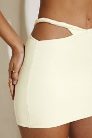 Nyomi Asymmetric Cut Out Twist Detail Mini Skirt in Ivory at Oh Polly