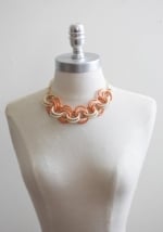 Orange statement necklace at Ruche at Ruche