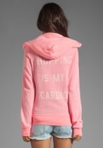 Pink hoodie with same text at Revolve