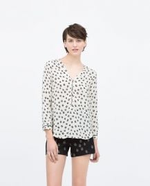 Printed top with front zip at Zara